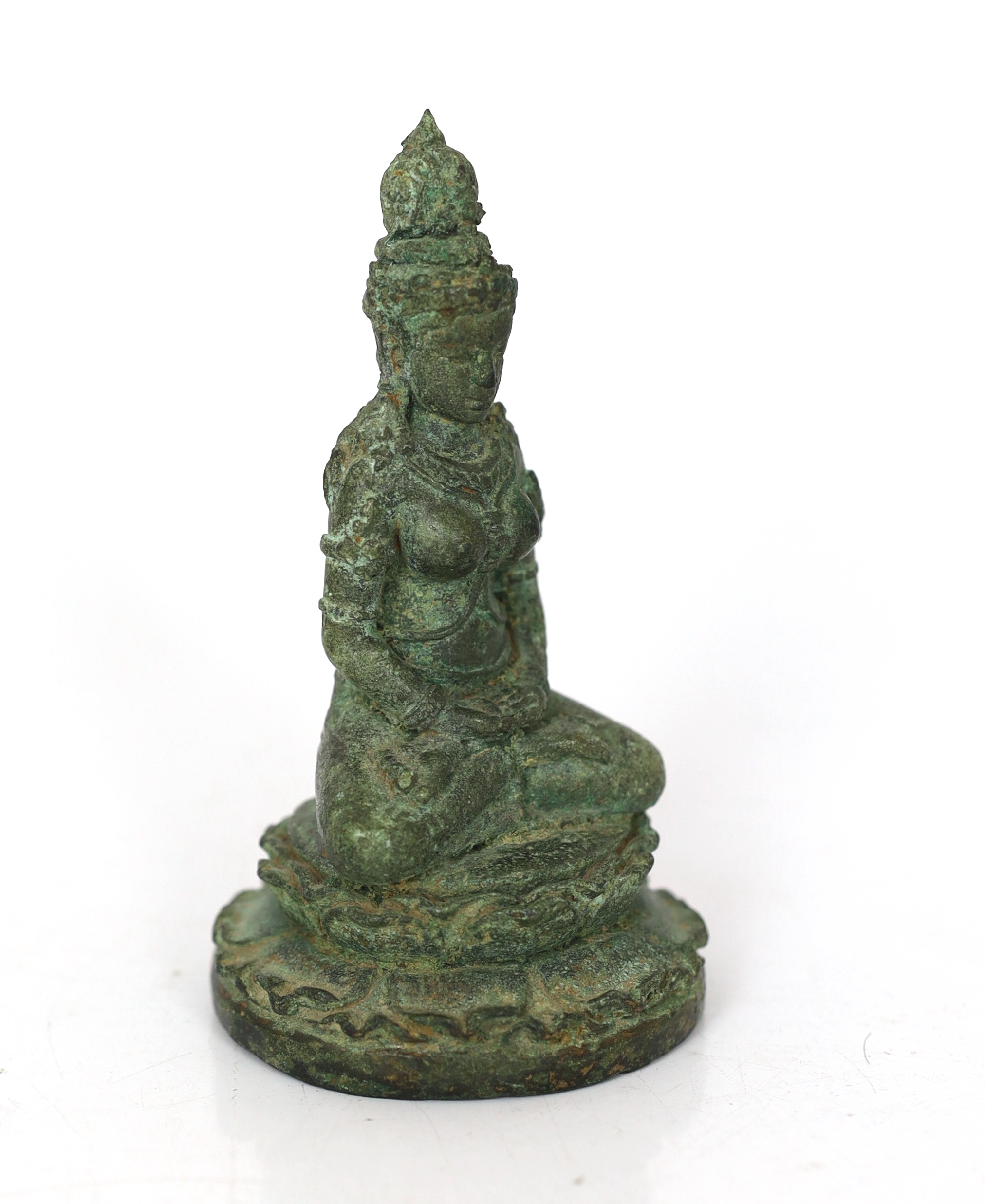 A bronze seated figure of Tara, Central Java, 9th century